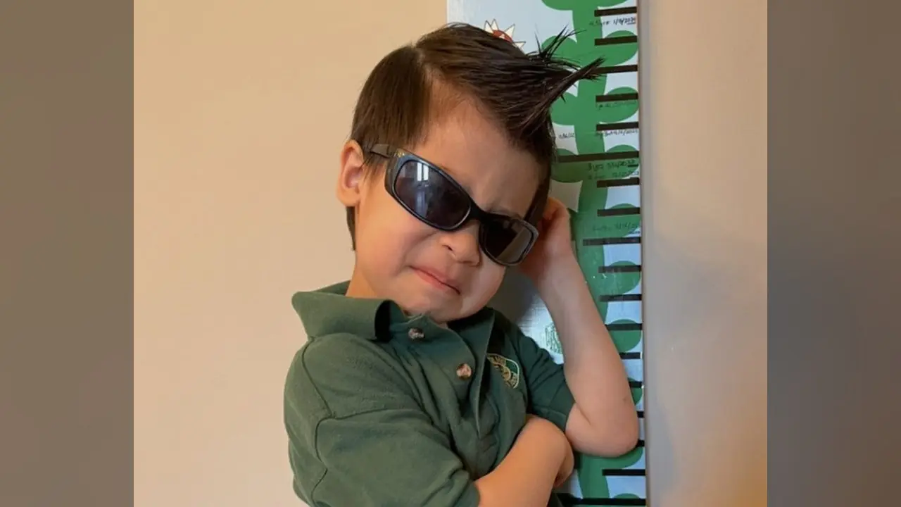 Jayden, 7, of Whitby, wearing sunglasses and posing confidently.