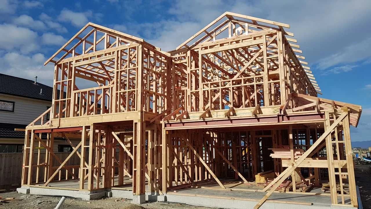 Timber frame of a residential house under construction; no people visible