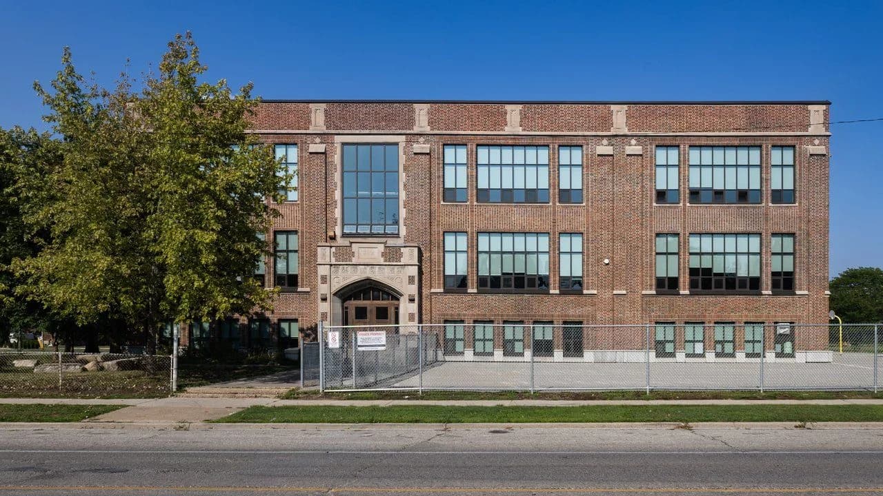 Brick elementary school building exterior; no people visible.