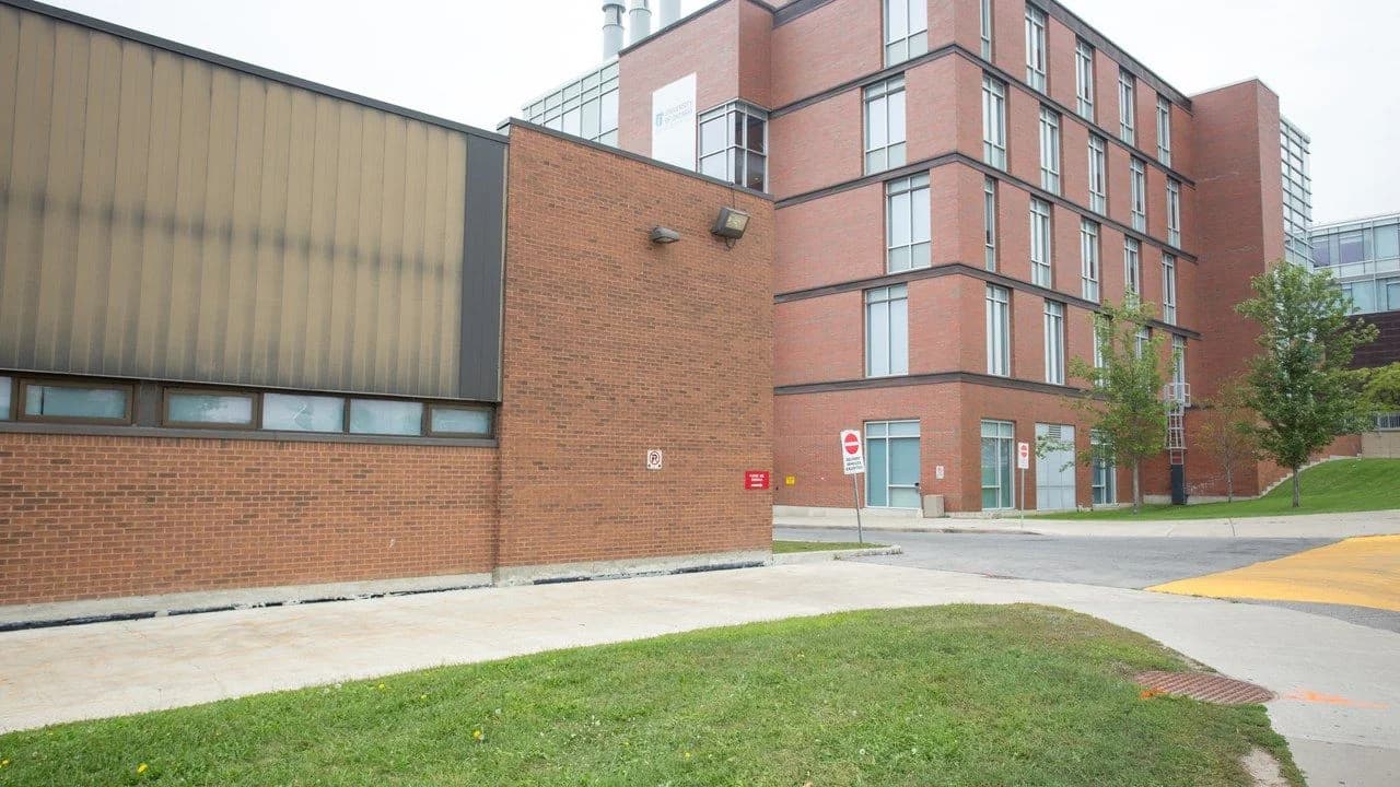 Brick campus building exterior on the shared Durham College / Ontario Tech Oshawa campus; no people visible