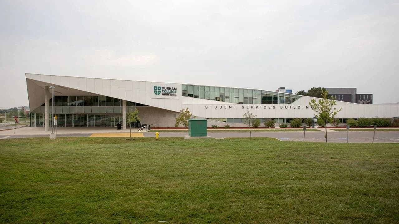 Durham College Student Services Building exterior with the college logo, on the Oshawa campus; no people shown.
