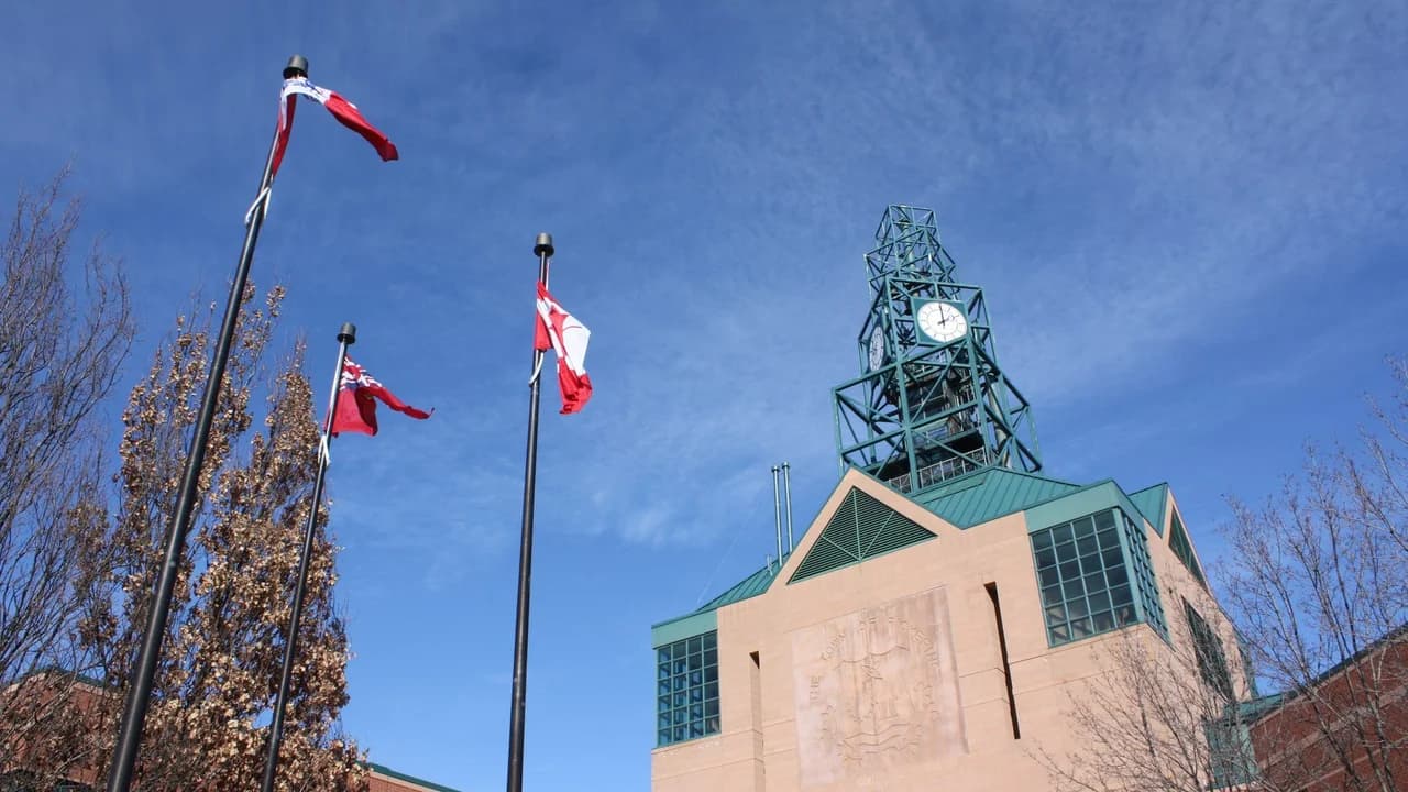 Pickering City Hall with flags flying; no people present. File photo.