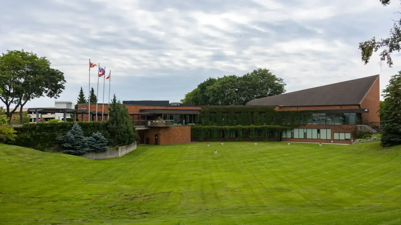 Whitby Town Hall, a low brick civic building behind a wide mown lawn, with flags flying; no people visible. File photo, not the area where Nadia was last seen.